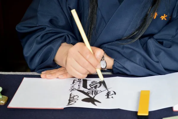 Team calligraphy workshop in Tokyo